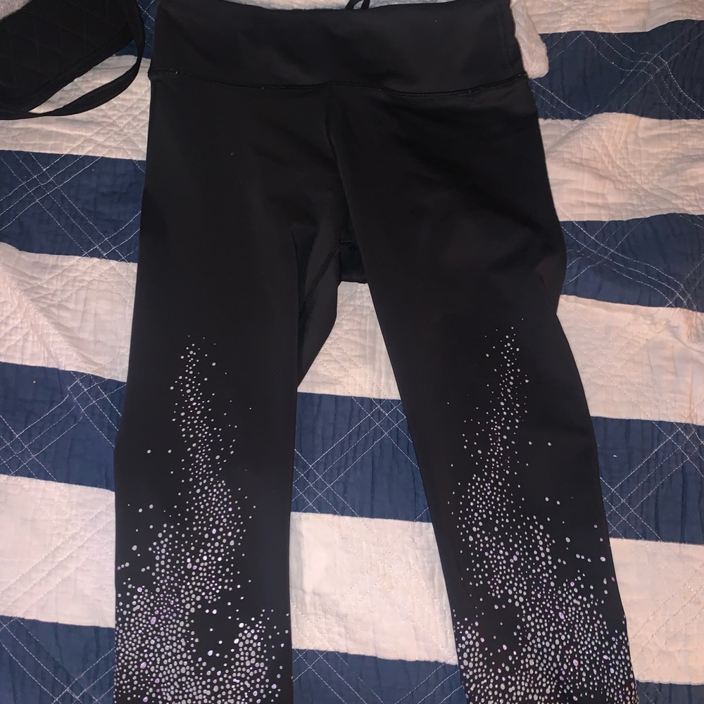Purple and white spotted Nike leggings
